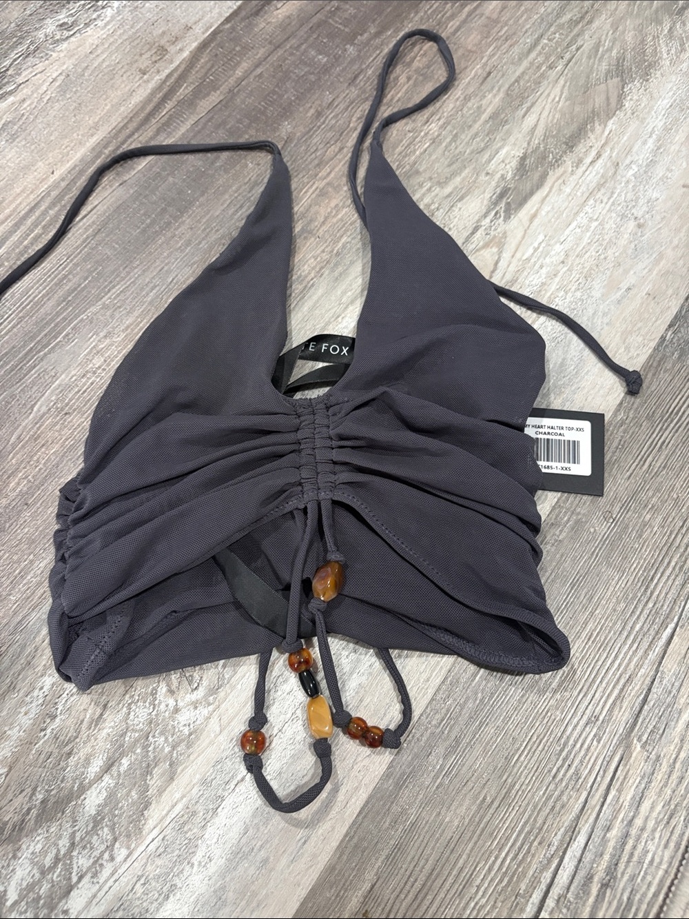White Fox Boutique Black Halter Ruched Crop Top with Amber Bead Accents
